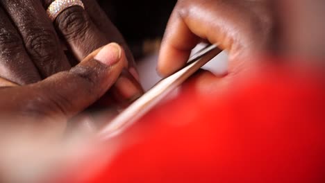 Filing-nails.-Close-Up.-African-hands