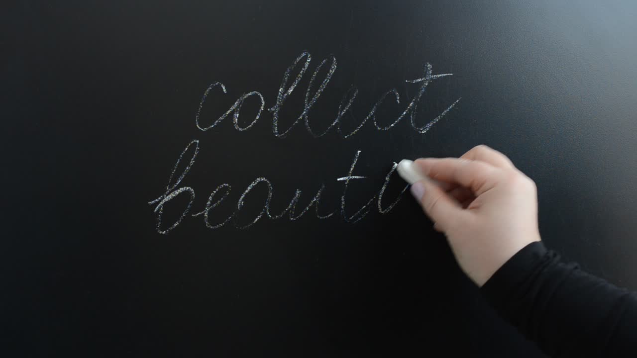 We write the popular phrase on a board. We write with chalk on a board