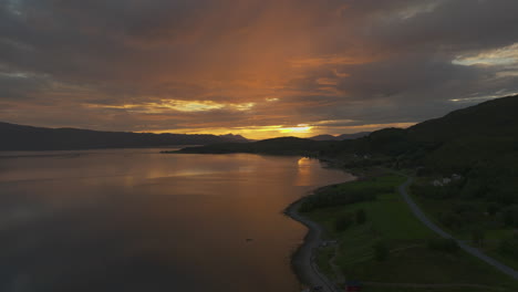 Beautiful-warm-sunset-over-fjord-and-colorful-sky-in-Norway