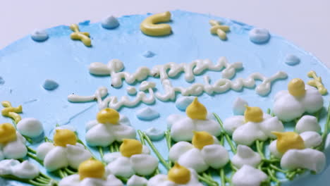 Zoom-out-of-detail-of-cosmatic-cake-chip-written-happy-birthday