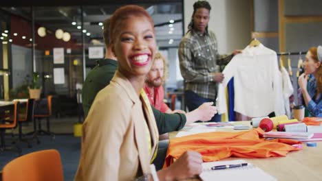 Portrait-of-happy-african-american-businesswoman-looking-at-camera-at-office