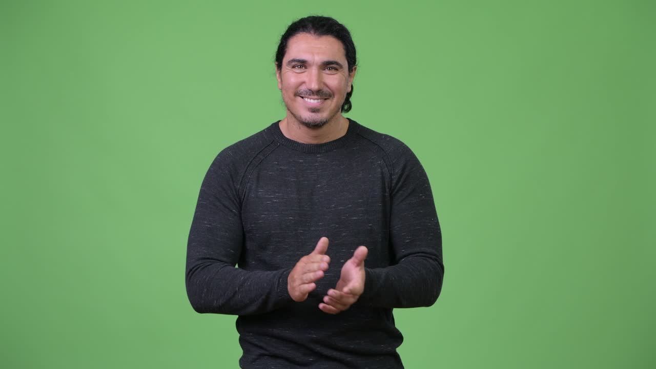 Happy handsome man clapping hands