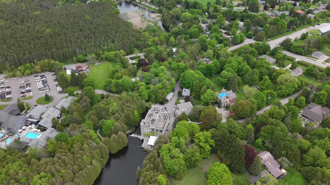 Millcroft inn and spa, surrounded by greenery and residential area, aerial view