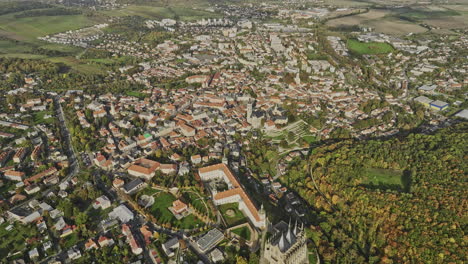 Kutna-Hora-Czechia-Aerial-v13-high-birds-eye-view-drone-flyover-hillside-residential-towards-the-town-center-capturing-picturesque-townscape-views-from-above---Shot-with-Mavic-3-Cine---November