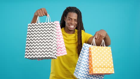 man holding shopping bags