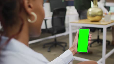 African-american-businesswoman-using-smartphone-for-video-call-with-copy-space