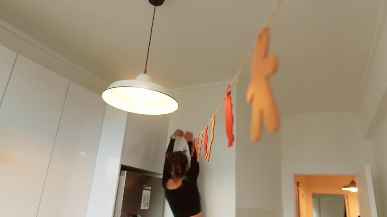 Woman Decorating Kitchen for the Holidays