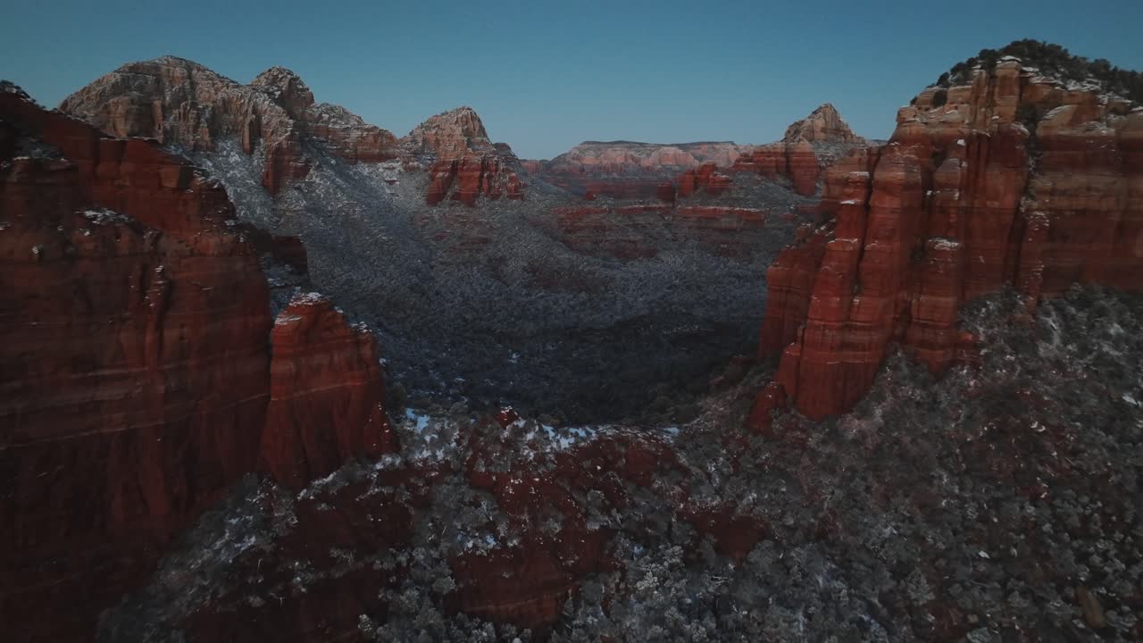 Rock Formation Covered With Snow In Sedona, Arizona At Sunset - Drone Shot