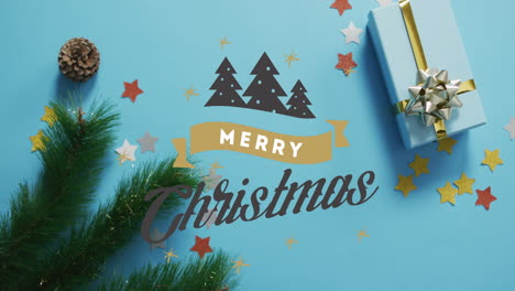 animation of merry christmas text and christmas trees over decorations and gift box