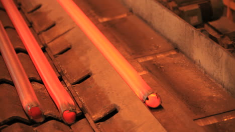 iron pipe production process. steel pipes moving on production line at plant