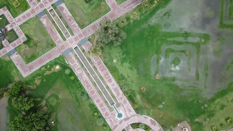 top down shot of a park area with clouds reflection in lake