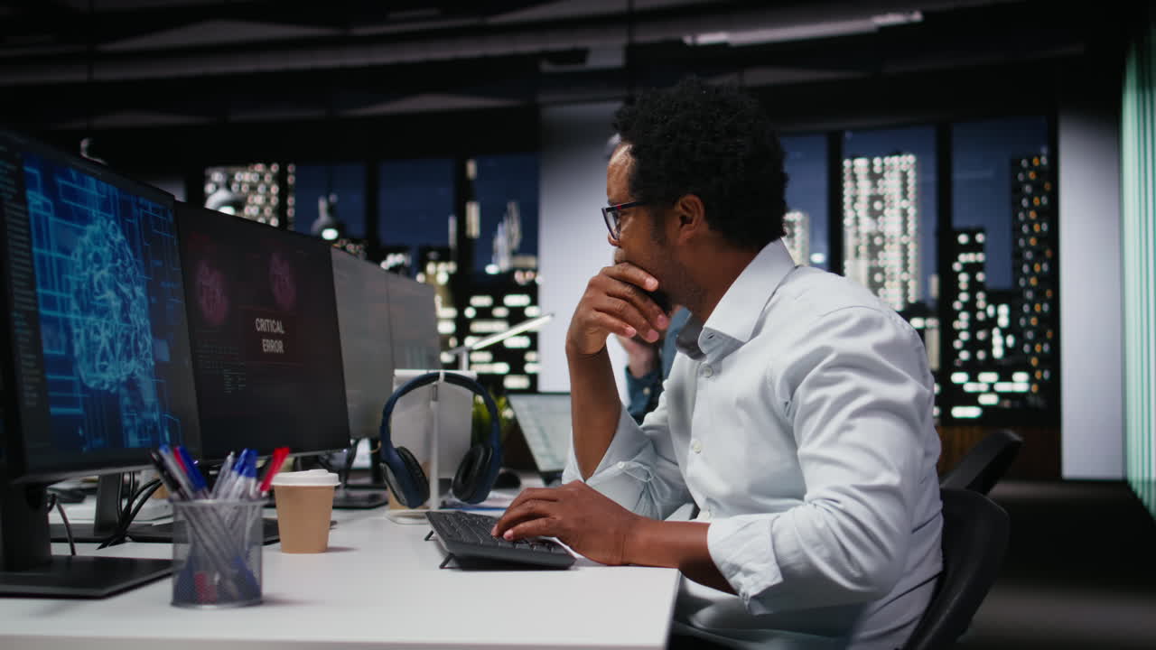 African American Programmer Reacting to Critical Error Message at Night