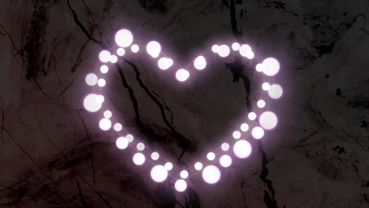 animación en forma de corazón de esferas blancas brillantes que pulsan sobre un fondo de textura oscura