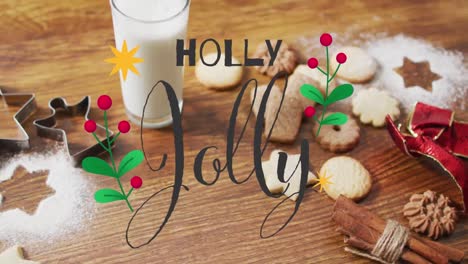 Animation-of-holly-jolly-text-over-christmas-cookies-and-decorations-on-wooden-background