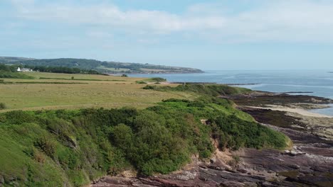 Traeth-Lligwy-eroded-coastal-shoreline-aerial-view-scenic-green-rolling-Welsh-weathered-Anglesey-coastline