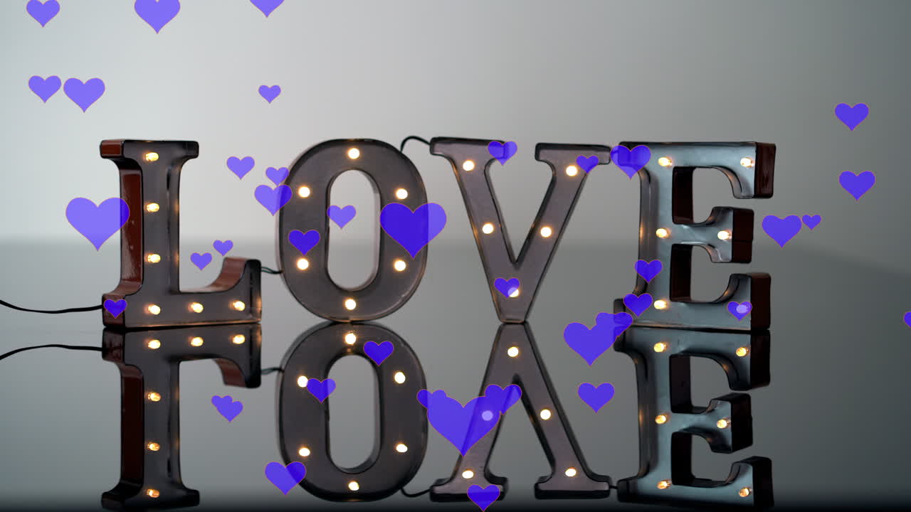 Love sign with reflection and blue floating hearts