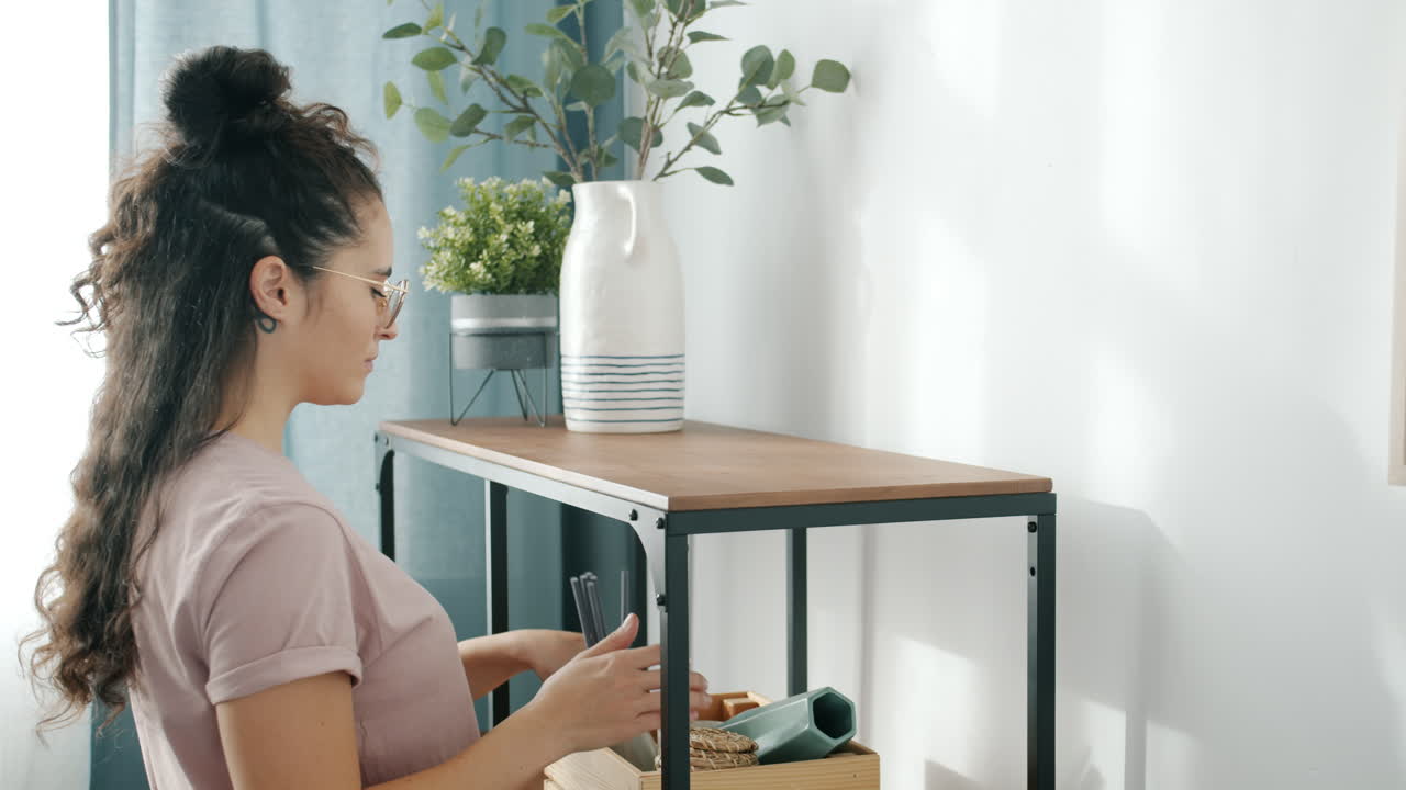 Woman Organizing a Shelf
