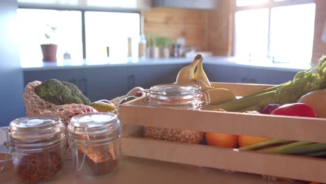 Close up of vegetables in sunny kitchen, in slow motion