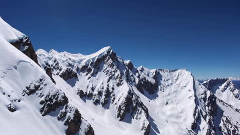 snow-capped mountain peaks under a clear blue sky