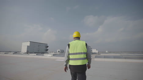 man walking on flat roof