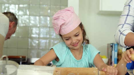 Family-preparing-dessert-in-kitchen