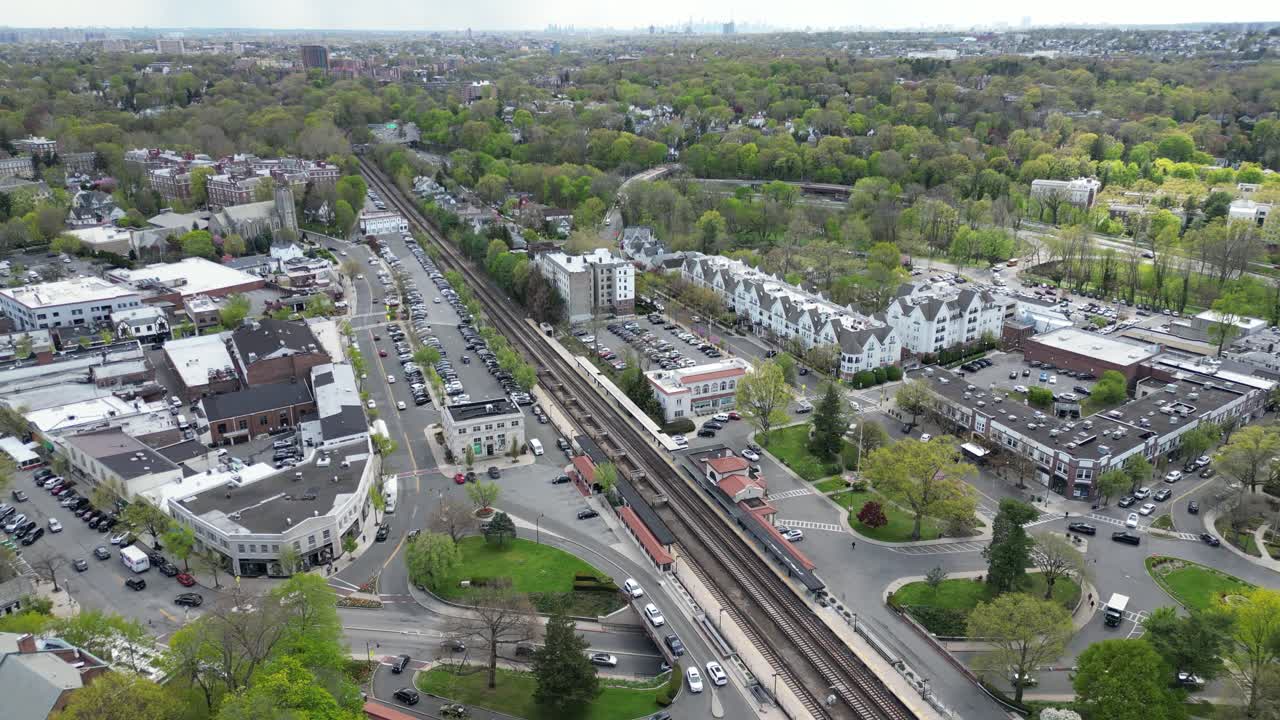 Horizontal drone footage capturing an aerial view of the railway and underpass in Bronxville, New York. Showcases transportation infrastructure and suburban surroundings.