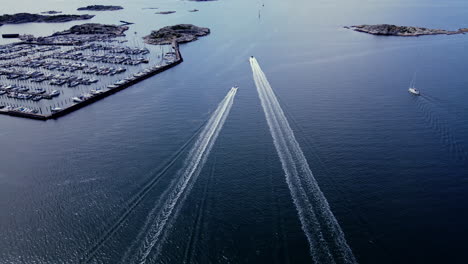 boats speeding over the waters of långedrag, gothenburg, sweden - aerial