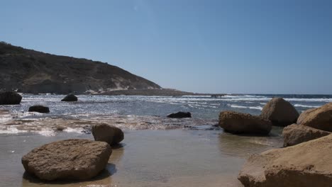 erosion prevention gozo beach boulders near the salt flats pans of zebbug gozo malta in 10 bit 4k 60fps