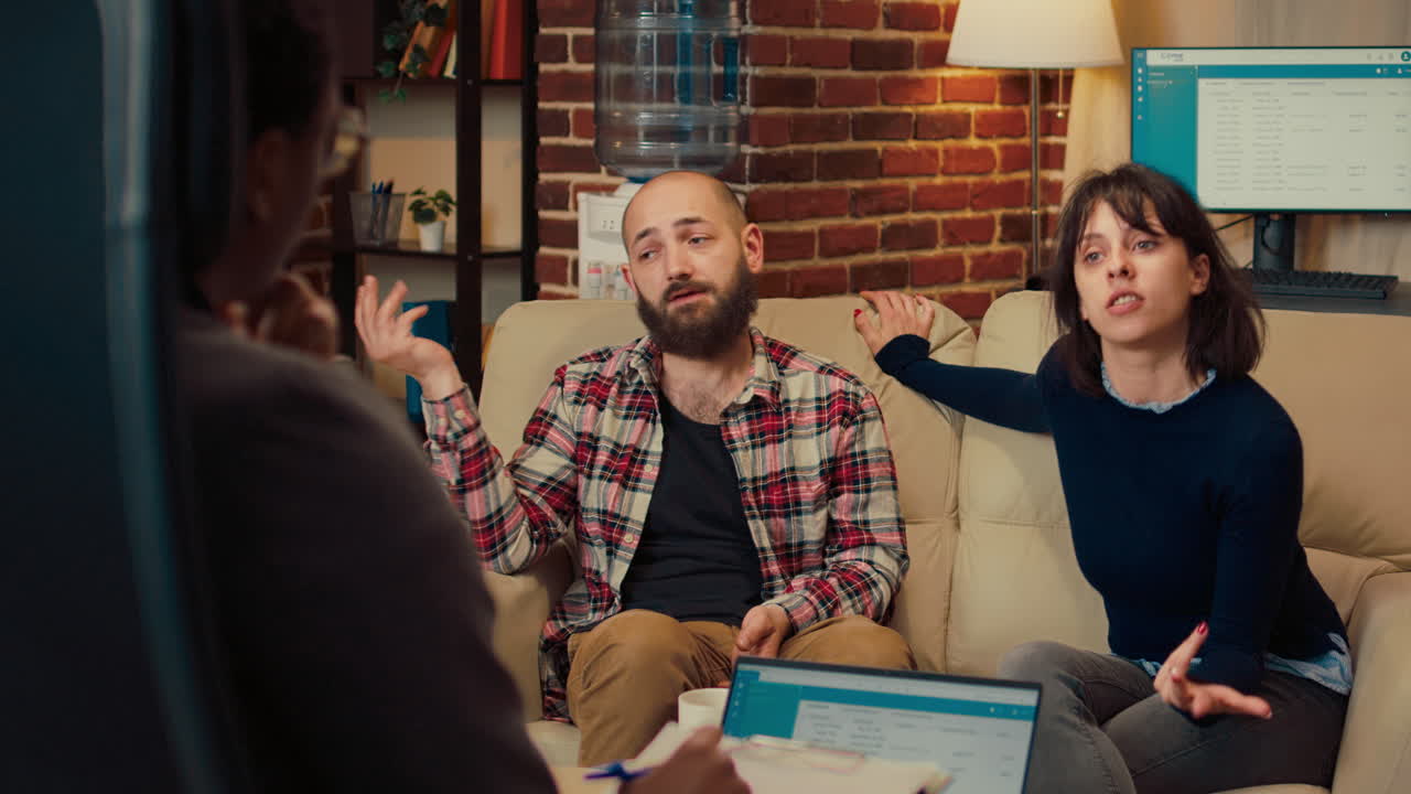 Married couple complaining about relationship at therapy session