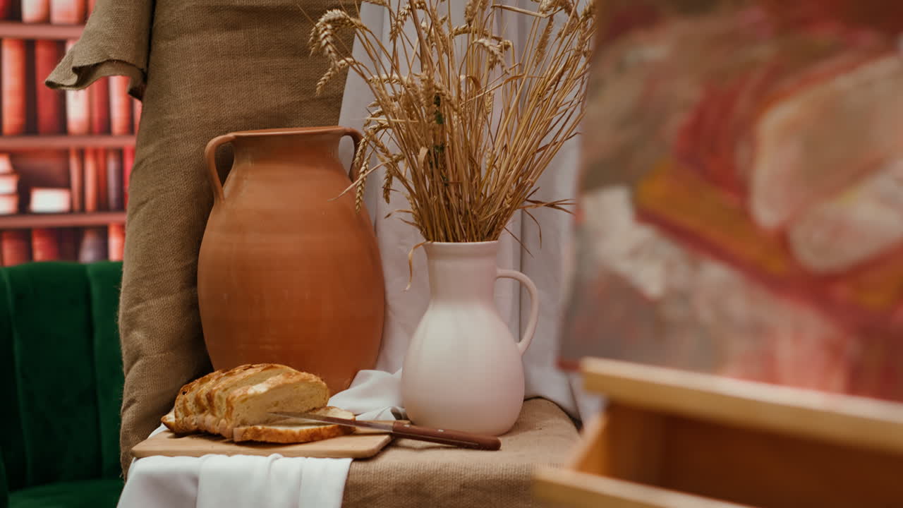 Still life with bread, pottery, and wheat