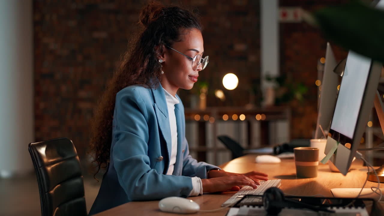 Happy, night and business woman on computer typing