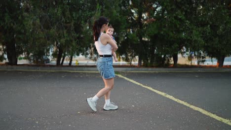 mother walking with baby in the parking lot