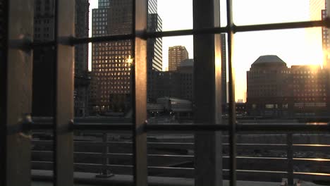 sunlight reflects on the windows of high rise office buildings