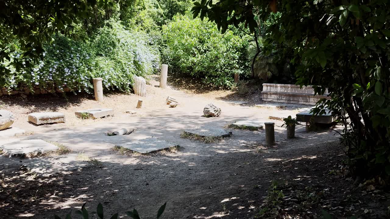 Ancient Ruins Amidst Lush Greenery in Athens National Garden