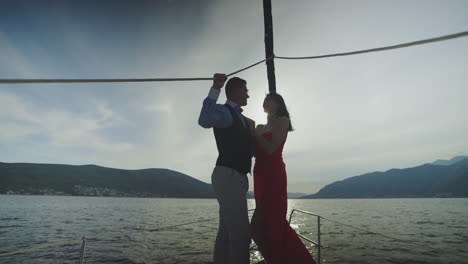 couple on a yacht at sunset
