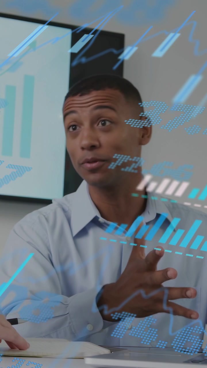 Vertical video: Man in biz meeting reacting to hand pointing checking tablet with blue AR sweeping