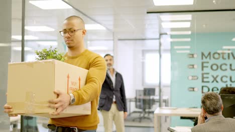 boss directs the exit to a dismissed employee