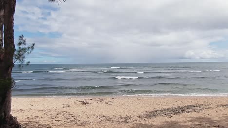 Aerial-view-of-Ocean-in-Haleiwa,-Oahu,-Hawaii-low-angle-forward