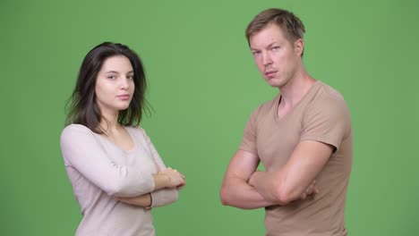 young couple with arms crossed together