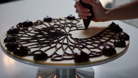 decorating a chocolate cake