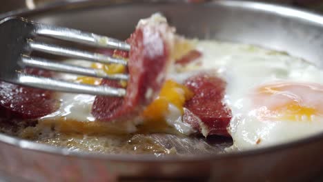 turkish breakfast: eggs and sausage in a pan