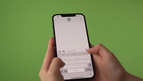 woman canceling an appointment on imessage in front of green screen