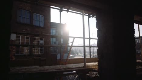 sunset through building construction