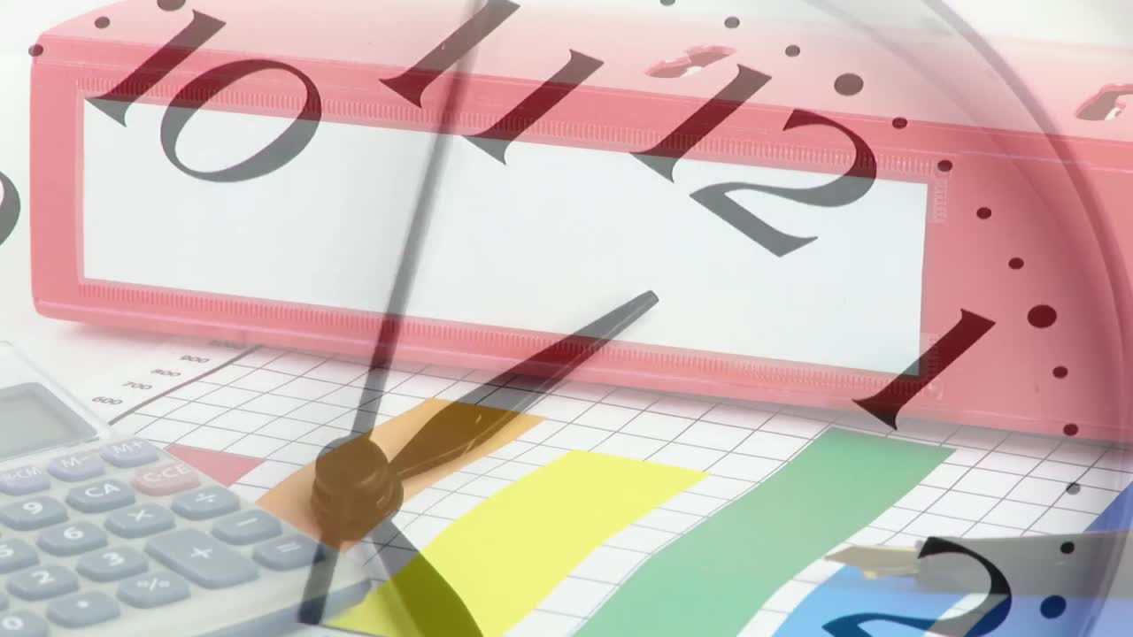 Animation of clock moving over office equipment