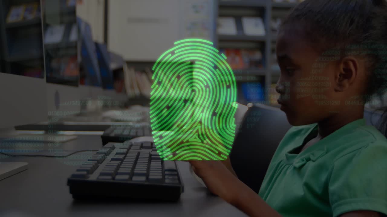Bio metric fingerprint scanner against boy using computer