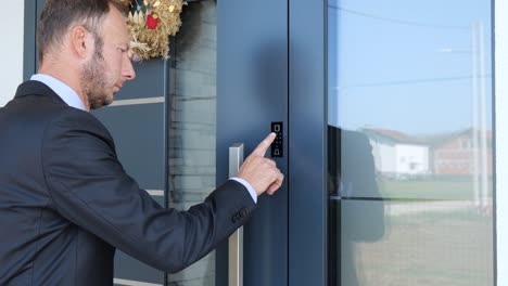 family man using keypad to lock home door, smart key safety future concept