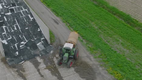 A-Tractor-Traveling-Around-The-Farm-Land-During-The-Day