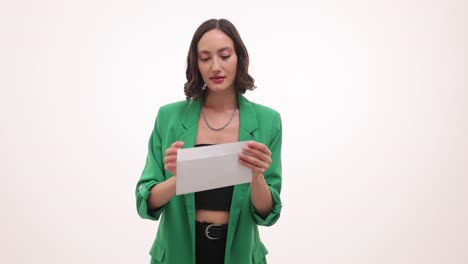 woman opening and reading an envelope