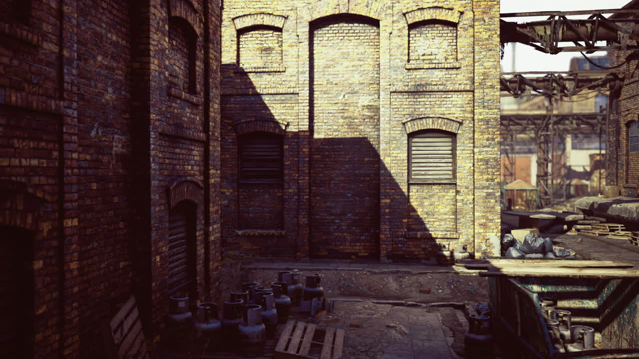 Abandoned warehouse yard bathed in golden afternoon sunlight