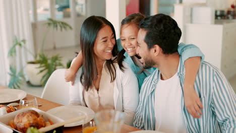 Family-dinner,-girl-hug-parents